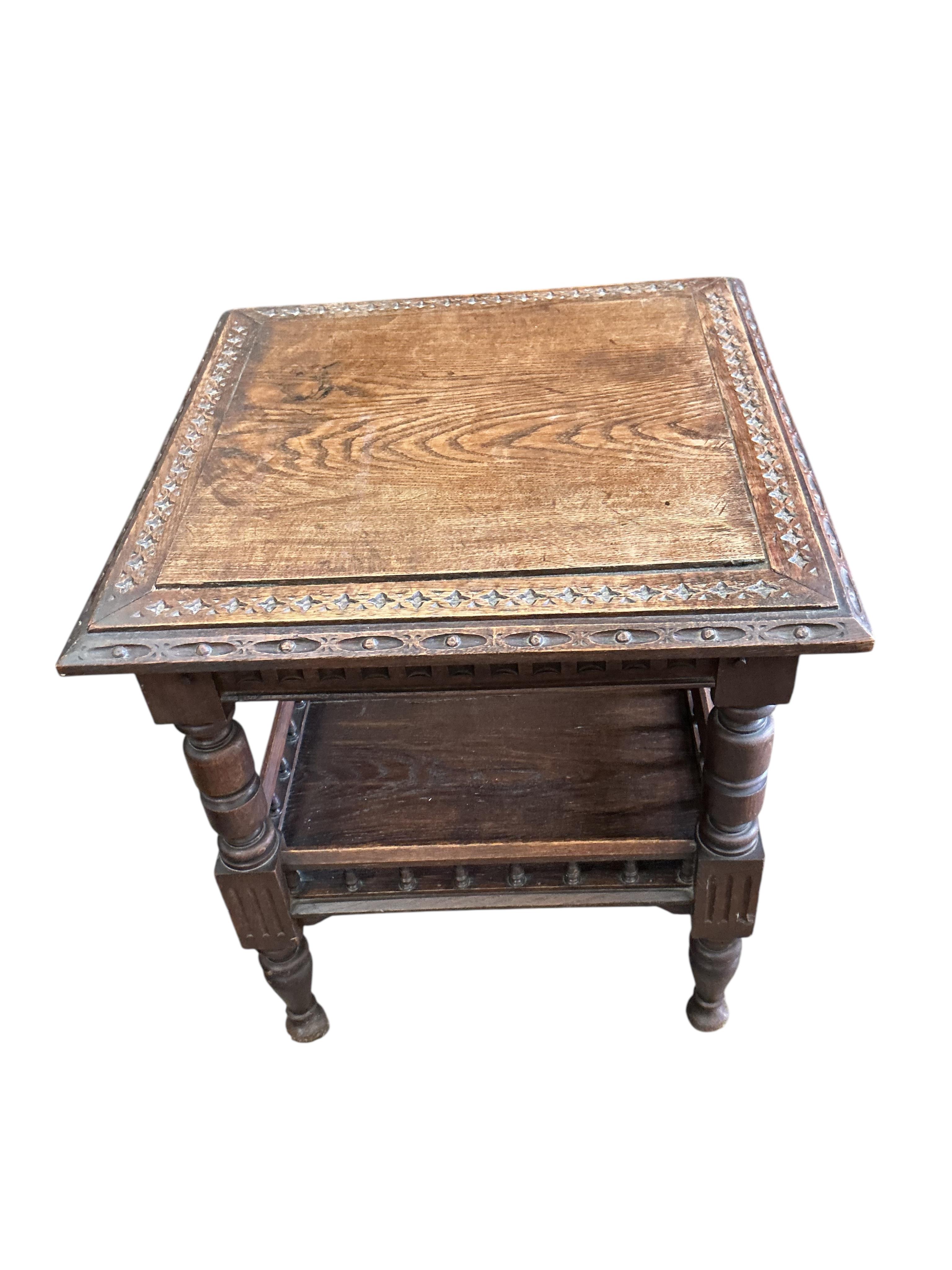 A late Victorian carved oak square two tier table, 59cm, height 66cm, together with a Victorian piano stool, a wall bracket and a Balinese wall mirror